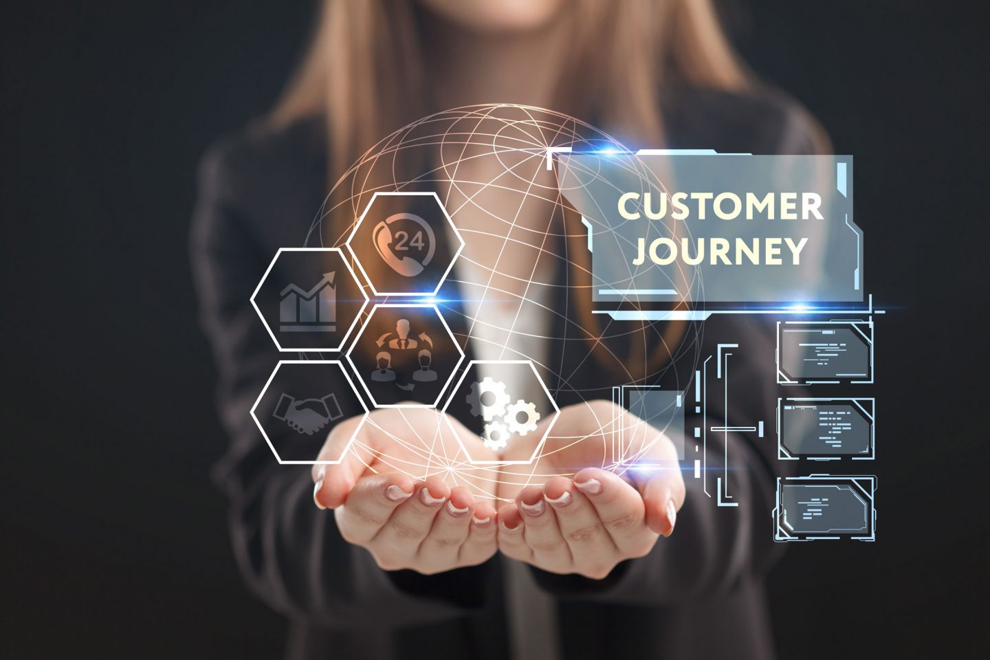 A business person holds a glowing digital globe as hexagon icons and the words Customer Journey float above their hands to show online experience.