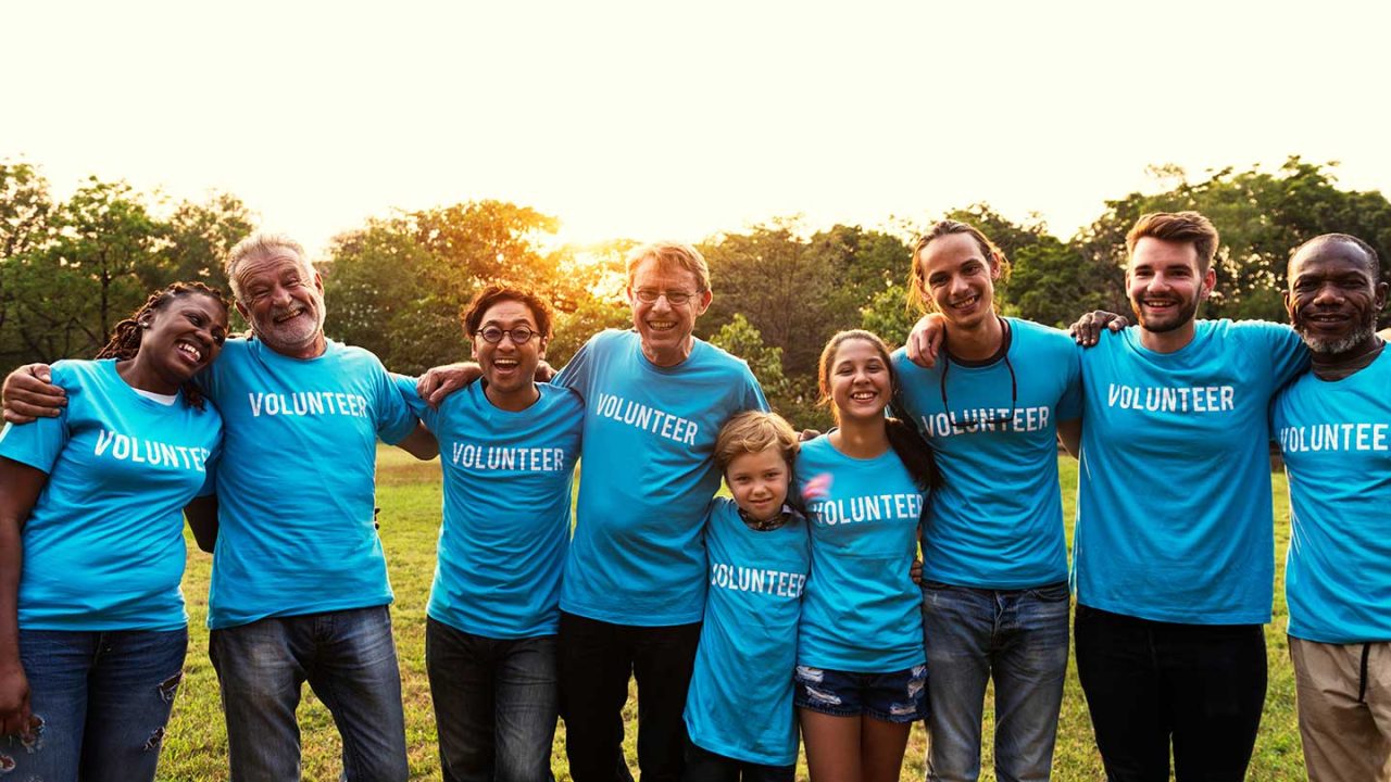 Team of volunteers from TPA HQ gathered outdoors, representing St. Louis-based ecommerce and retail values.