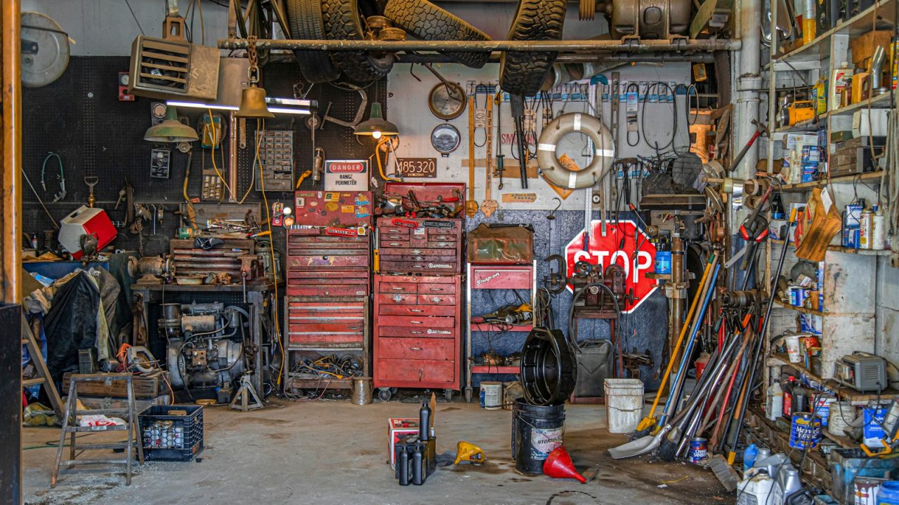 Close-up of auto parts and mechanic's tools, representing an auto parts loyalty and rewards program for repeat buyers