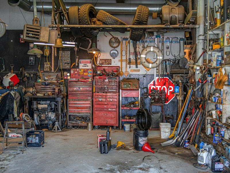 Close-up of auto parts and mechanic's tools, representing an auto parts loyalty and rewards program for repeat buyers
