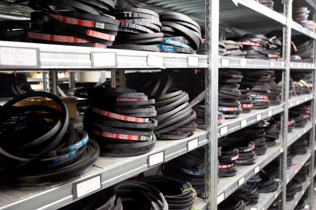 Automotive parts organized on warehouse shelving, representing inventory that must stay in sync between an ERP and BigCommerce storefront