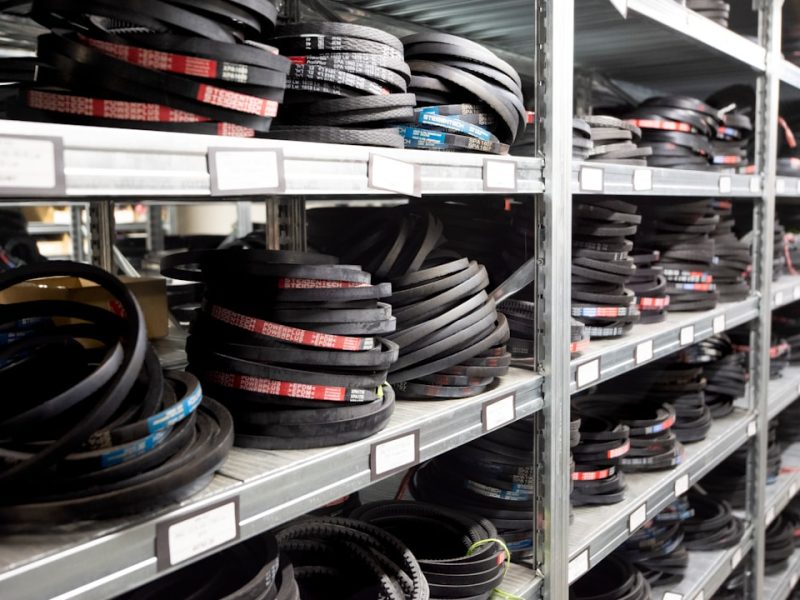 Automotive parts organized on warehouse shelving, representing inventory that must stay in sync between an ERP and BigCommerce storefront